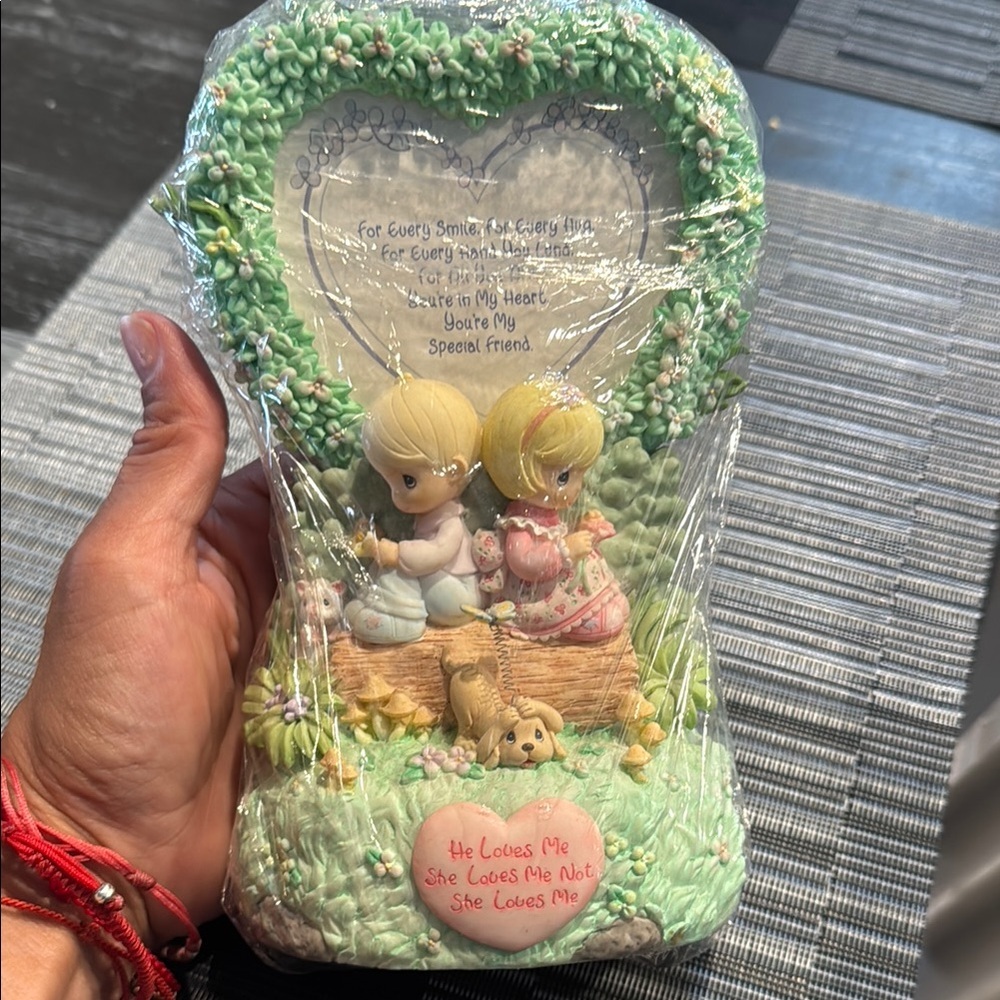 Precious Moments Figurine with Green Accents